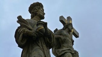 Historical statue with crucifix in Prague