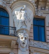 sculptures on the buildings of the old city in Riga