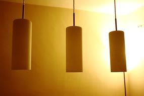 lamps near the yellow wall