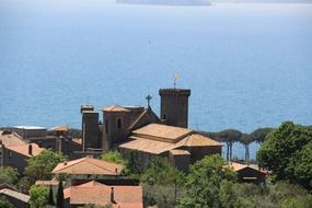 lake bolsena italy blue water red roof building