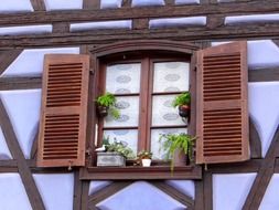 window with wooden shutters