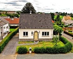 house with a green garden in belgium