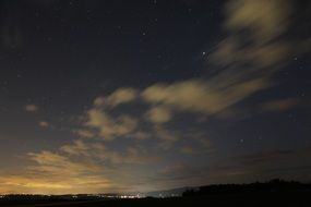Stars and city lights at night
