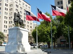 flags near the sculpture in santiago