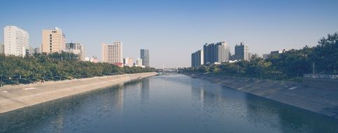 fog over the river in the city, zhengzhou