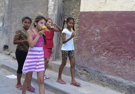 children eat ice cream in Cuba