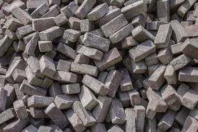 grey stone building blocks in disorder, background