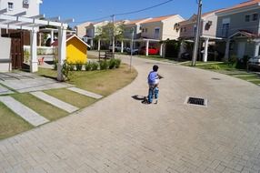 child boy on bike in village