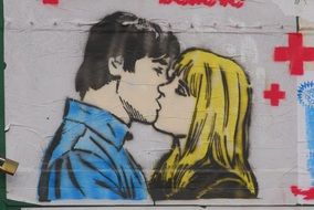 Man and woman are kissing each other graffiti