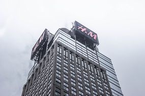 monitors on top of a skyscraper