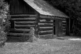 black and white picture of a village cottage