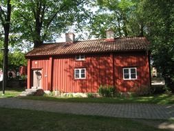old red wooden house at summer