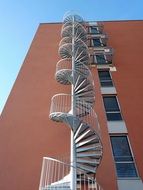 Spiral staircase on the facade of the building