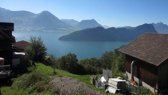 landscape of the farm by the mountain lake in Switzerland