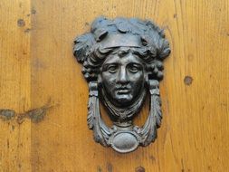 doorway knocker on a wooden door close-up