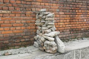 stones near a brick wall