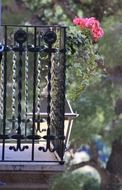 wrought iron balcony with a flower