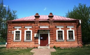 red brick house in the countryside