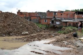 dirt and damaged building in carapicuiba city