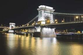 Light posts of a bridge at night