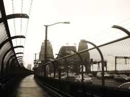 Black and white photo of bridge in the city