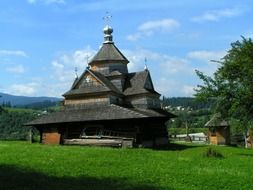 aged wooden orthodox church in countryside, ukraine, karpaty