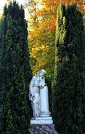 stone statue among picturesque park