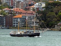 A sailing ship on a background of a city landscape of a sydney