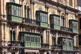 facade of a building with balconies in Valletta