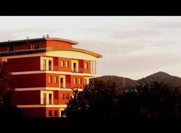 house with balcony at sunset