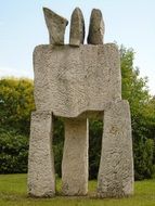 modern stone statue in a park