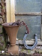 rusty horseshoe near an old house