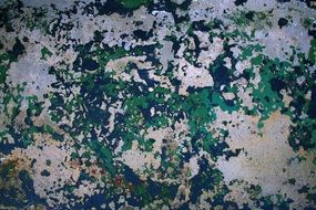 weathered paint on a concrete wall
