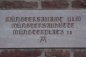 sign with an unusual font on the wall