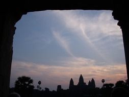 view through the opening to Ankor Wat at dusk