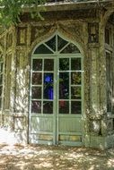 Old damaged door with glass