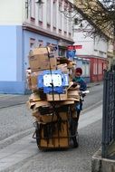 man with cart of scrap on the street