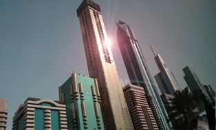 sun reflection on luxury skyscrapers in Dubai