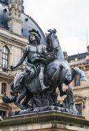 equestrian statue in front of the louvre museum