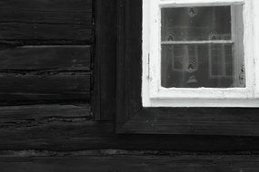 traditional wooden house with white window close-up