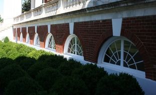 semicircular white windows on the basement