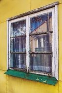 vintage window on a yellow wall