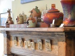traditional pottery on fireplace