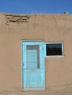 Blue door in a stone building