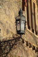 historical lantern on the facade of the castle