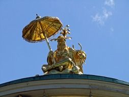 golden sculpture on the dome in potsdam