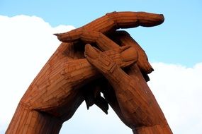 metal sculpture of hands