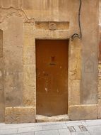 brown wooden door in Spain