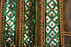 golden and emerald oriental pattern in buddhist temple