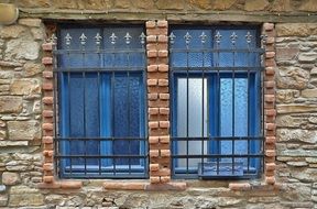 window with bars in a brick house